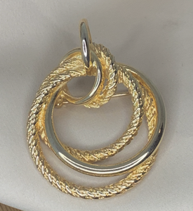 Sophisticated Gold Stylized Circular Brooch