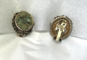 Rough green stone clip on earrings set in ornate bronze RENTAL