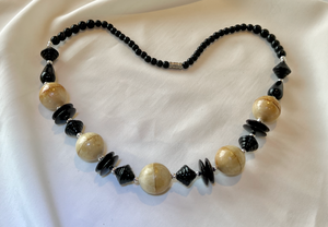 Blonde wood with black bead on necklace RENTAL