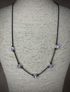 Dainty black chain with silver holding a rhinestone necklace RENTAL