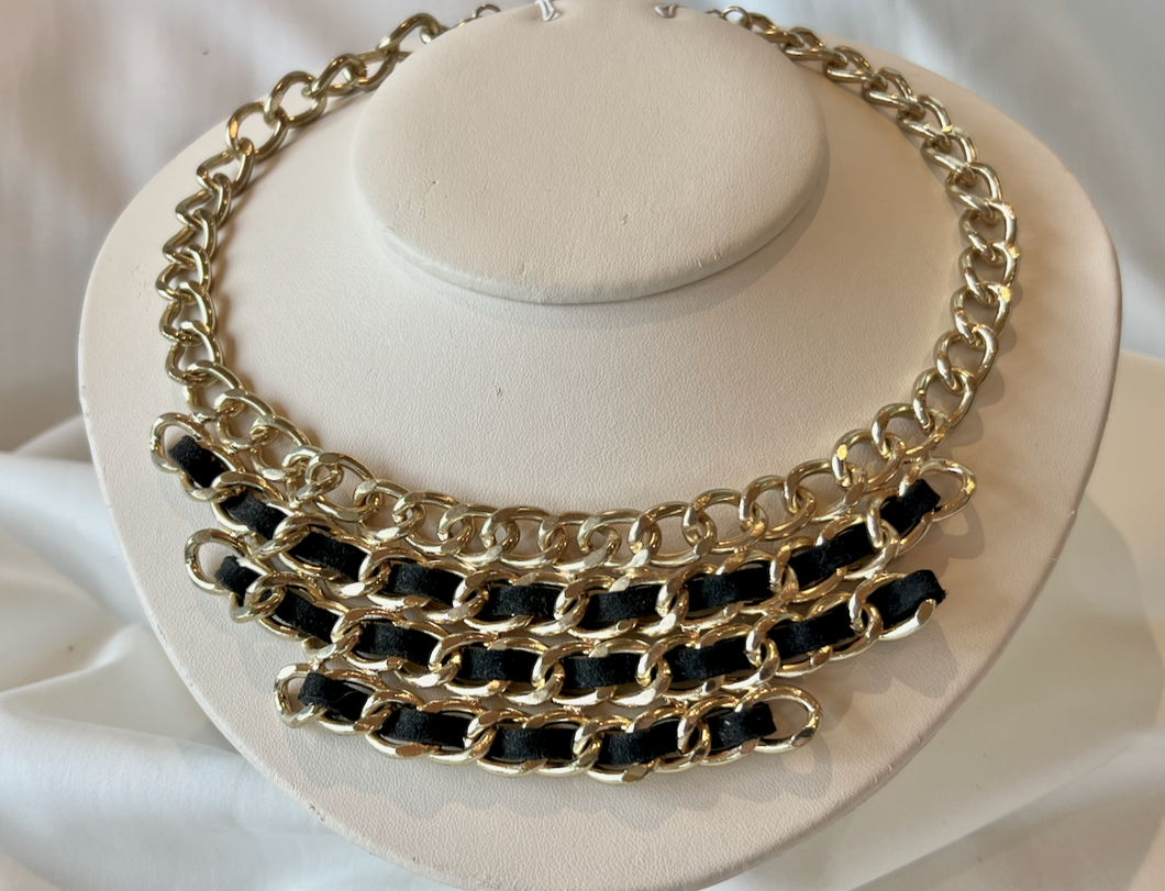 Black on 4 layers of heavy gold link choker RENTAL