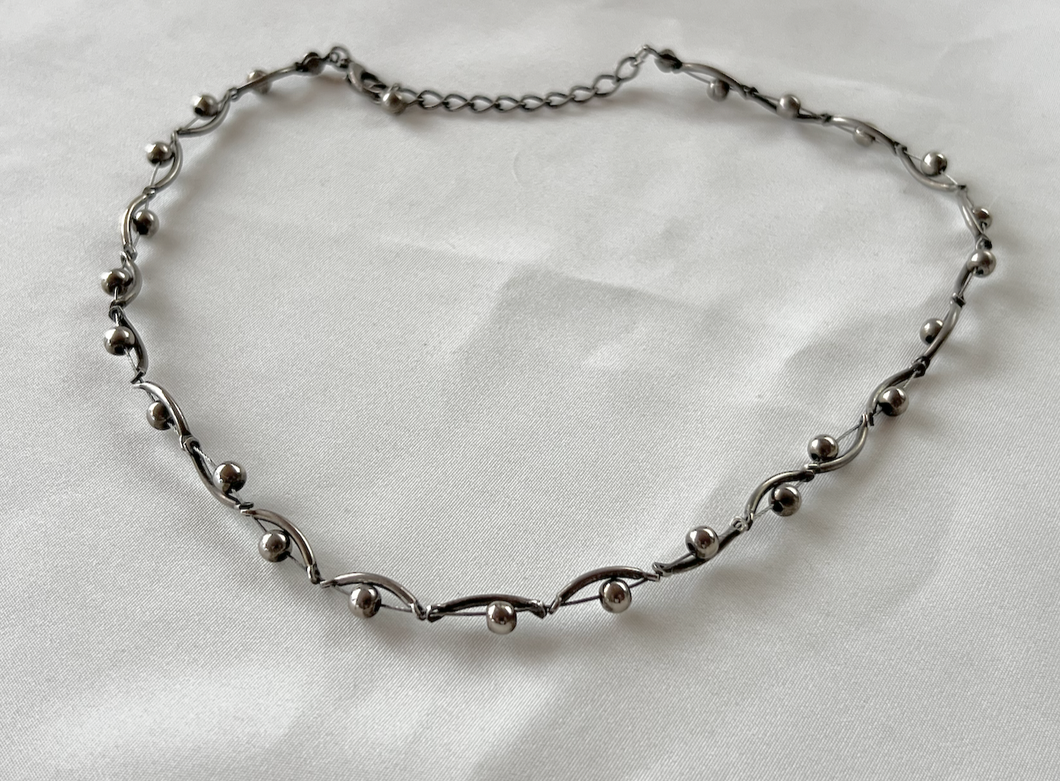 Delicate choker made of bent silver beads over circles RENTAL