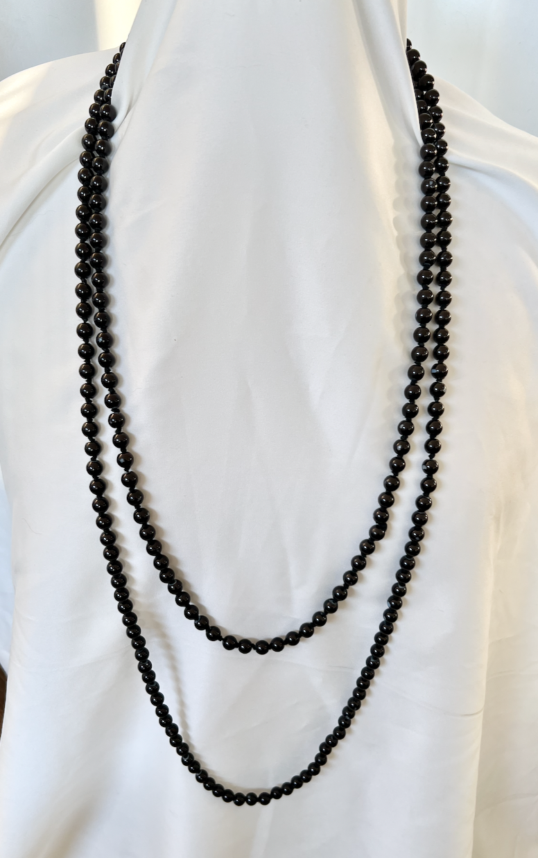 Long black hand knotted glass pearl necklace. 78