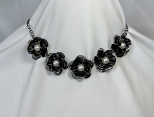 Five metal flowers with pearl centers on a chain necklace RENTAL