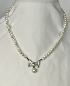 Lovely pearl necklace with rhinestone bow above a pearl drop RENTAL