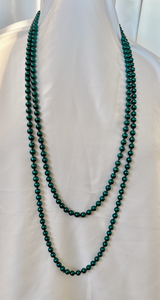 Blue undertones on these dark green glass pearls 80" necklace RENTAL