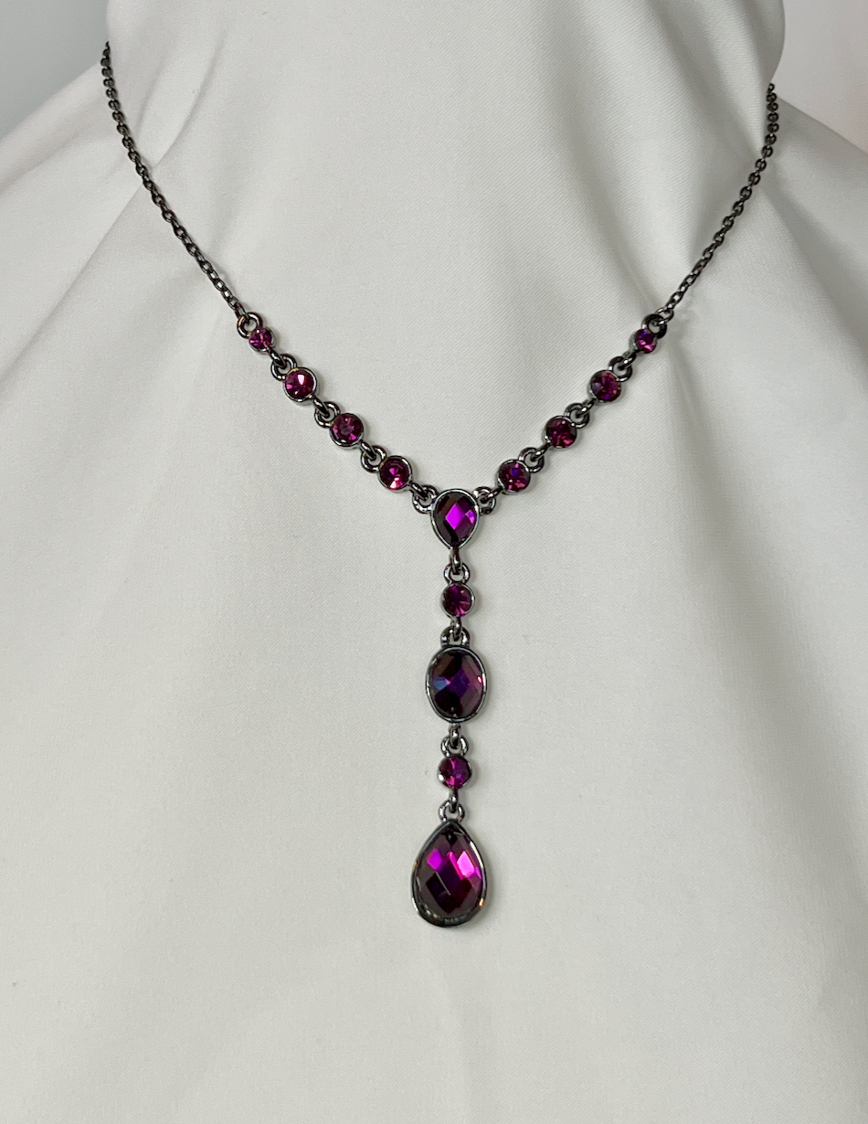 Delicate white metal neclace with graduated bright purple rhinestones RENTAL