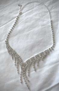 Flowing rhinestone necklace with V shape and dangles RENTAL